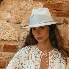 Founded, owned, and operated by women, Freya redefines the Panama hat with modernized silhouettes, UPF 50+ coverage, and organic materials. Embracing 3000 years of tradition, each piece is handcrafted with toquilla palm plant fibers by artisans in Northern Ecuador, and designed with a contemporary eye, resulting in stylish, versatile pieces made to last a lifetime. With a broad brim, and oversized honey-colored grosgrain band, finished with an asymmetrical fold, the Gardenia Hat in Fog might be Wool Hat Men, Packable Hat, Palm Plant, Crown Heights, Straw Fedora, Sky Color, Plant Fibres, Embroidered Hats, Wool Hat