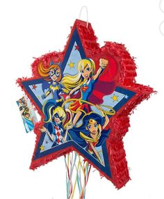 a star shaped pinata with the dc super hero girls characters on it and streamers