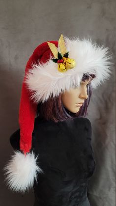 This is a super soft, deep red fur Santa hat. It is over two feet long from the brim to the ball, and will fit 22 to 24 inch heads. It is trimmed with a long, fluffy stark white fur, for a gorgeous Classic. It can be ordered with, or without a set of golden bells. The bells are a bright gold, that have little star cutouts on them. They are tied with a gold ribbon, a sprig of holly, and a trio of tiny golden bells to add a festive, golden touch. The bells are sewn onto the hat. If you need a spec Adjustable Red Hat For Holiday, Red Adjustable Mini Hat For Christmas, Red Adjustable Festive Hat, Red Adjustable Holiday Hat, Novelty Red Winter Hat, Red Fur, Red Stockings, White Fur, Bright Gold