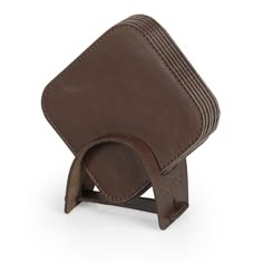 a brown leather case with a metal holder on the front and side, for an electronic device