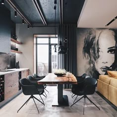 a dining room table with chairs and couches in front of a painting on the wall