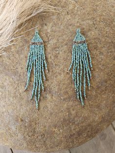 Fall Fringe - Turquoise Gorgeous turquoise fringe with speckled brown accent. This is a beautiful, simple and easy to wear pair. Lightweight and made with the highest-quality materials. These very lightweight, and are made with the highest quality glass beads, more resistant to breaking. These beautiful earrings should last a lifetime and make for a beautiful, one of a kind gift for yourself or a loved one. Easy to wear, day or night! ⸙ Length: 3 inches  ⸙ Beads: The highest quality of glass bea Turquoise Beaded Drop Earrings With Spacer Beads, Turquoise Drop Beaded Earrings, Turquoise Dangling Beaded Earrings, Turquoise Dangling Bead Drop Earrings, Light Blue Beaded Dangle Jewelry, Turquoise Beaded Earrings For Gifts, Adjustable Turquoise Earrings With Spacer Beads, Turquoise Beaded Earrings With Faceted Round Beads, Turquoise Drop Beaded Earrings With Tiny Beads