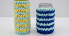 two crocheted can coolers sitting next to each other