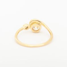 This ring captures a graceful, rolling wave in solid gold to curl around a bezel-set diamond. Accentuated by another, smaller diamond to the side, this center diamond within its golden frame. The low-profile design welcomes an active lifestyle, without compromising size or impact. This alternative engagement style can be worn with the matching band for a perfect pairing to treasure forever. Made in the U.S.A. 14 karat gold with 0.25-0.3ct Modern Brilliant Cut White Diamond (recycled, VS clarity, Golden Frame, Engagement Style, Bezel Set Diamond, Matching Band, Profile Design, Active Lifestyle, Bezel Setting, White Diamond, Perfect Pair