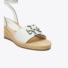 A vacation-ready sandal, the Ines espadrille wedge features a leather upper — detailed with a double-stacked logo — and a buckled strap that wraps around the ankle for a flattering and secure fit. Set on a jute wedge sole, the slight lift elevates any look. Designer Espadrilles, Heeled Mule, Heeled Mules Sandals, Espadrille Wedge, Mule Sandals, Sport Sandals, Footwear Design Women, Wedge Sandal, Espadrilles Wedges