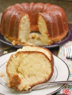 a bundt cake on a plate with a slice cut out and ready to be eaten