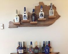 a wooden shelf with liquor bottles on it