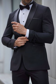 Elevate your style with our Slim Fit Shawl Collar Black Tuxedo Suit. Make a lasting impression at any formal occasion with this timeless and sophisticated ensemble. From Suitharbor's Spring Summer Collection. Crafted from a luxurious blend of 80% Wool and 20% Polyester. This impeccably tailored suit boasts a sleek silhouette, featuring a Shawl collar, Double slit, Double Fleto Pocket, Single Button, and Full Lining for a polished look. Your package includes the Jacket, Vest, Pants, Shirt, Bow Tie, and Pocket Square. To keep this Black Tuxedo Suit in premium condition, Dry clean only. Ensure the perfect fit by providing your height and weight during purchase, referencing our model's size for guidance. Groom Classic Suit, Black Tux Spring Wedding, Black And White Tuxedo Wedding, Wedding Suits Groom Classy, Grooms Tux Ideas, Black Wedding Suit For Groom, Black Wedding Groom, Black Wedding Tuxedo, Black Tuxedo Wedding