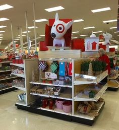 a display in a grocery store filled with lots of food and decorations, including a fake dog head