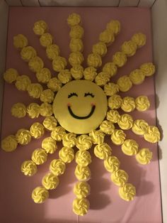 a cake in the shape of a smiling sun