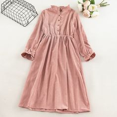 Material: PolyesterMaterial: AcrylicMaterial: SpandexDecoration: ButtonSilhouette: A-LineSeason: AutumnStyle: CasualNeckline: StandWaistline: NaturalSleeve Length(cm): FullPattern Type: SolidSleeve Style: Flare SleeveGender: WomenDresses Length: Mid-Calfchest:100cm waist:68-100cm sleeve length:57cm length:105cm Gray and Black length are 95cm Pink Long Sleeve Dress With Ruffles For Fall, Feminine Beige Long Sleeve Midi Dress, Feminine Long Sleeve Beige Midi Dress, Casual Long Sleeve Pink Dress For Fall, Casual Solid Long Sleeve Dress For Winter, Casual Long Sleeve Dress For Winter, Beige Long Sleeve Vintage Midi Dress, Vintage Beige Long Sleeve Midi Dress, Vintage Long Sleeve Beige Midi Dress