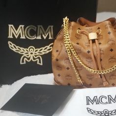 New With Tag***Authentic Mcm*** Include Dust Bags. Smoke Free Home! Used Once/Try On Only. Luxury Brown Bucket Bag As Gift, Luxury Brown Bucket Bag As A Gift, Bucket Bag With Gold-tone Hardware For Gift, Gift Shoulder Bag With Gold-tone Hardware, Luxury Bucket Bag With Adjustable Strap As Gift, Designer Gold Bucket Bag With Dust Bag, Designer Gold Bucket Bag For Shopping, Gold Bucket Bag With Dust Bag For Daily Use, Designer Gold Bucket Bag For Travel