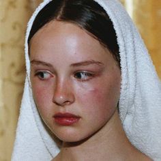 a young woman wearing a towel on her head