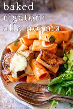 a white plate topped with pasta and vegetables