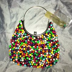 Vintage Beaded Handbag Bag Measures 8”X 5” Handle Measures 5” Handle Is Metal And Is Moveable Working Clasp Close Any Questions Please Ask! Multicolor Embellished Pouch Evening Bag, Multicolor Beaded Rectangular Evening Bag, Multicolor Beaded Pouch Evening Bag, Embellished Multicolor Evening Bag, Multicolor Beaded Evening Bag, Elegant Multicolor Beaded Bag, Evening Bags With Colorful Beads In Multicolor, Multicolor Evening Bag With Colorful Beads, Multicolor Evening Bags With Colorful Beads