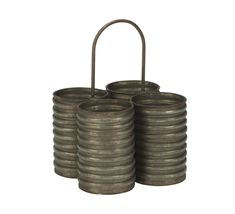 three metal canisters stacked on top of each other with a handle in the middle