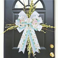 a door with a bow and flowers on it