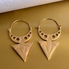 Geometric Earrings, Hoop Earrings, Triangle Earrings, Boho Earrings, Brass Earrings, Statement Earrings, Ethnic Earrings, Gift for Her Metal:-brass ❥ Customers' satisfaction is our biggest priority, please contact us with any questions/queries for future or existing orders, and we will do our best to make sure you are happy with your order. ❥Please make sure to add the correct address during checkout. You can return your purchased item within 15 days after successful delivery. We offer a 100% "M Handmade Geometric Gold Earrings, Geometric Brass Earrings For Gift, Handmade Geometric Brass Jewelry, Nickel-free Geometric Brass Earrings, Symbolic Single Brass Earring, Symbolic Nickel-free Hoop Earrings, Symbolic Brass Earrings With Ear Wire, Brass Earrings With Unique Design For Gift, Symbolic Drop Earrings For Festivals