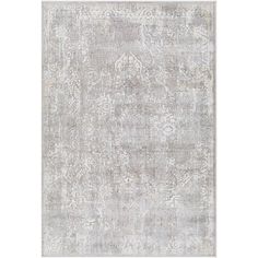 an antique style rug in grey and white with floral design on the bottom, along with a light gray background