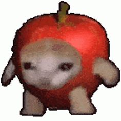 a stuffed animal with an apple on it's head and the bottom part of its body