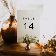 a table number sitting on top of a wooden table