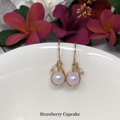 "These petite pretties are so perfect for everyday day. Iridescent Swarovski Pearls are intricately wrapped in a braided weave and accented with beautiful, sparkling Swarovski Crystals. Gracefully suspended from handcrafted French ear wires. Shimmering and feminine with just enough \"frosting\" to be glamorous! - All components are 14kt yellow gold filled." Dainty Bridal Earrings With Ear Wire For Anniversary, Dainty Ear Wire Bridal Earrings For Anniversary, Rose Gold Hypoallergenic Teardrop Earrings For Gift, Nickel Free Dangle Earrings For Bridesmaids, Feminine Crystal Drop Earrings As Gift, Feminine Crystal Drop Earrings For Gifts, Handmade Feminine Earrings For Gift, Handmade Dangle Earrings For Bridesmaids, Handmade Drop Earrings For Bridesmaids