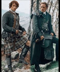 two men dressed in kilts standing next to each other on a rocky hill side