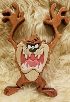 an image of a wood carving of a cartoon character