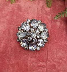 Riveted Austria crystal vintage brooch. Stunning round brooch with pale blue crystal stone in various sizes arranged into a round floral design.  Circumference- 35mm Roll top clasp  Riveted back Super sparkly piece!! Would look beautiful on any garment. Box not included display purposes only. Party Costume Jewelry Brooches, Anniversary Rhinestone Round Brooches, Anniversary Brooches With Rhinestones, Anniversary Round Rhinestones Brooches, Anniversary Round Brooches With Rhinestones, Round Rhinestone Brooches For Formal Occasions, Formal Round Brooches With Rhinestones, Round Formal Brooches With Rhinestones, Formal Round Rhinestone Brooches