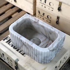 a white box sitting on top of a wooden pallet