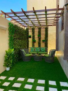 an outdoor living area with grass and plants