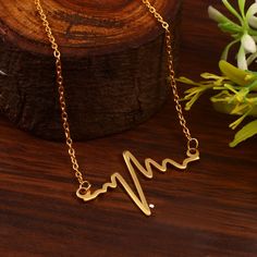 Heartbeat Necklace /  18k Gold plated Heartbeat Necklace / EKG Necklace / Gold Heartbeat / Live Love Laugh Necklace / Solid Gold Heartbeat MEANINGFUL HEARTBEAT NECKLACE  18k GOLD PLATED THE CHAIN IS A BEAUTIFUL CABLE LINK CHAIN THAT CAN BE WORN FROM 16 TO 18 INCHES. PLEASE LET ME KNOW IF YOU WOULD LIKE IT LONGER, I CAN ADD AN EXTENSION TO IT. THE CHAIN HAS A STURDY LOBSTER LOCK WHICH IS THE SAFEST. METAL:  BRASS  STYLE: HEARTBEAT NECKLACE/ MEANINGFUL HEARTBEAT NECKLACE LENGTH: CAN BE WORN FROM 1 Gold Stainless Steel Heart Necklace For Mother's Day, Heartbeat Necklace, Live Love Laugh, Live Love, Necklace Length, Name Necklace, In A Heartbeat, Necklace Gold, Link Chain