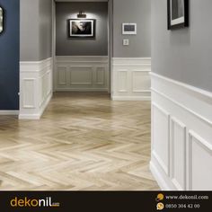 an empty hallway with blue walls and white trim