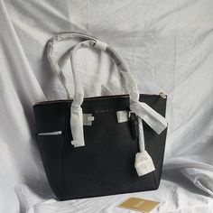 Questions? Leave A Comment Below! Michael Kors Black Satchel With Removable Pouch, Michael Kors Black Satchel For Daily Use, Michael Kors Black Double Handle Bags, Michael Kors Black Satchel Bag, Michael Kors Black Satchel For Travel, Michael Kors Black Satchel For Office, Michael Kors Black Bag For Everyday, Black Michael Kors Bag For Office, Michael Kors Black Bag With Removable Pouch