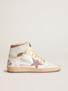 A reinterpretation of high-top sneakers with an authentic soul: inspired by our Ball Star model, our Sky-Star sneakers have an American college vibe and a feel of the basketball scene of the Eighties. This model, with a white leather upper, features a pink leather star and heel tab, and the Golden Goose signature on the neck of the ankle, a reference to the childhood dream of having your favorite sneakers signed by basketball legends. The white crackle leather toe, beige nylon tongue and white laces with a yellowed effect complete the look. The Golden Goose, Childhood Dream, The Eighties, Basketball Legends, Lace Jewelry, Star Sneakers, Bag Handle, Golden Goose, Gift Collections