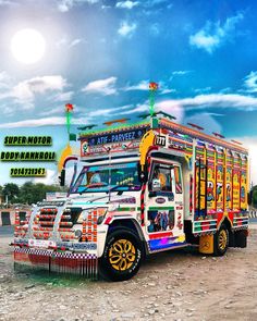 the colorful bus is parked on the side of the road in front of a blue sky