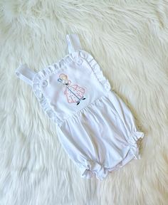 This listing is for a sun suit. This adorable embroidered Bo Peep sun suit will look adorable on your little girl.  I can also change the colors. If you are looking for a certain color scheme just let me know. I am happy to change it to meet your needs. Thanks so much for stopping by my shop White Cotton Bubble Romper For Vacation, White Summer Bubble Romper For Playtime, Fitted Cotton Bubble Romper For Beach, Fitted Cotton Bubble Romper For The Beach, Beach Cotton Onesie With Ruffles, Cotton Summer Bubble Romper, White Sleeveless Onesie With Ruffles, Cute Cotton Onesie For Vacation, Fitted White Bubble Romper For Beach