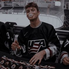 two hockey players sitting next to each other