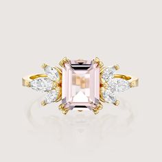 Guaranteed to take your breathe away, the 1.50CT morganite stone at the core of the Daphne is serene. The morganite is adorned with 6 dazzling marquise diamonds, contributing extra glamour to the ring. The elegance of this piece is incomparable as it radiates royalty and allure. Due to the nature of the stone the color of the morganite may vary. All features can be customized! Please contact us if you wish to make changes, we love making custom designs. All of our jewelry is carefully handmade i Morganite Diamond Ring With Accent Stones, Rose Gold Topaz Ring With Morganite And Accent Stones, Pink Morganite Jewelry With Gemstone Accents, Pink Morganite Ring With Gemstone Accents, Fine Jewelry Pink Topaz Ring With Gemstone Accents, Pink Topaz Ring With Gemstone Accents, Morganite Diamond Ring With Brilliant Cut, Emerald Cut Morganite Jewelry With Center Stone, Heirloom Morganite Diamond Ring With Gemstone