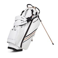 a white golf bag with black and gold accents