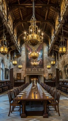 a long table with chairs and chandeliers in a large room