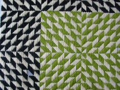 two black and white quilts with green squares