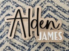 wooden name sign with the word'alden james '