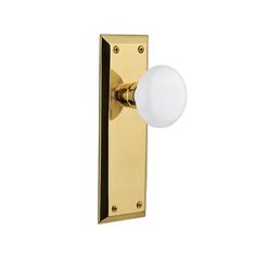 an image of a door knob with a white ball on it's side and a gold plated handle