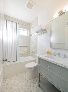 a bathroom with a sink, toilet and bathtub