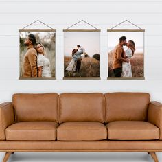 three frames hanging on the wall above a couch in a living room with a leather sofa