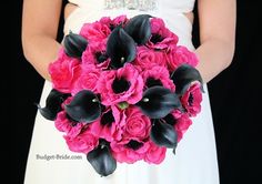 a bride holding a bouquet of pink and black flowers