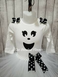 "Halloween Orders Last day to order for guarantee delivery for halloween will be Oct. 22. Thank you. This adorable ghost costume will look adorable on any little one. Please select the size needed when ordering. Top will be a long sleeve bodysuit/shirt with a glitter ghost face vinyl image on the front. The tutu skirt will be all white, white/black, or all black made on a crochet band with two layers of tulle and a removable bow on an alligator clip. Shoulder bows will be added, if you do not wa Fitted White Tutu Dress For Costume Party, White Long Sleeve Tutu Dress For Party, Cute Halloween Costume Tutu Dress, Cute Tutu Dress For Halloween Costume, White Fitted Tutu Dress For Costume, Cute Halloween Tulle Tutu Dress, Fitted Tutu Dress For Birthday Halloween, Baby Costumes Girl, Last Day To Order