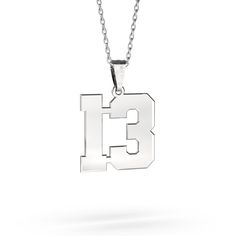 "Gold necklace number 13" Give the perfect gift of a personalized number necklace to your athlete! The number necklace in sport font is the perfect item for all sports fans. Have one or two numbers custom made on this pendant, donning your favorite player's number around your neck. This unisex pendant looks great on everyone! It will be a perfect gift option for school teams. It is the perfect gift for birthdays, special occasions, and for your children that they can use for a lifetime. Constructed of premium Tungsten. Oxidation resistant, will never get tarnished or change color. Hypoallergenic, will not cause irritation for sensitive skin. Safe to wear in water. Our custom number necklace is strong and durable. Details: - This Necklace comes with a Chain - This product has a lifetime war Date Necklace, Sports Fonts, Number 13, Number Necklace, Silver Numbers, Gold Number, Wolfram, All Sports, Necklace Personalized