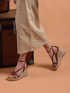 When in Rome, wear a Rome Wedge! Featuring a gorgeous leather loop centred around our signature chevron, the Rome is a genuine outfit-maker. This grown-up wedge manages to be both sophisticated and summery, pairing equally perfectly with long linen dresses or chic shorts. Just add a straw hat and you’re all set for sunny city breaks and beachside bars. Crafted from leather: made with the finest materials Contrast ecru stitching: craftsmanship in every detail Wrap-around ankle strap with gold che Luxury Leather Wedge Sandals With Woven Sole, Luxury Woven Leather Wedge Sandals, Classic Luxury Leather Wedge Sandals, Luxury Leather Wedge Sandals For Vacation, Long Linen Dresses, Work Travel Bag, Chic Shorts, Fairfax And Favor, Womens Espadrilles Wedges